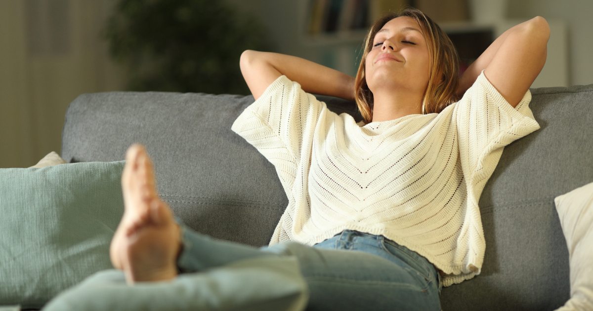 someone lying on a couch resting